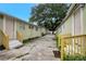 A row of cozy apartments showcases a charming exterior with easy access walkways and ample natural light at 8413 N Hamner Ave # A, Tampa, FL 33604