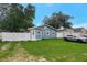 Charming blue home with a well-maintained lawn and white picket fence at 8413 N Hamner Ave # A, Tampa, FL 33604