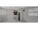 Clean, modern kitchen with white cabinets, floating shelves, and stainless steel appliances at 8413 N Hamner Ave # A, Tampa, FL 33604
