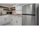 Modern kitchen with stainless steel appliances, white cabinetry, and butcher block countertops at 8413 N Hamner Ave # A, Tampa, FL 33604