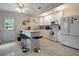 Bright kitchen with white cabinets, stainless steel appliances, and an island with bar seating at 8413 N Hamner Ave # A, Tampa, FL 33604