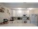 Well-lit kitchen features white cabinetry, modern appliances, and a stylish backsplash at 8413 N Hamner Ave # A, Tampa, FL 33604