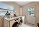 Bright laundry room with front loading washer and dryer and exterior access door at 8413 N Hamner Ave # A, Tampa, FL 33604
