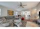 Inviting living room featuring a comfortable seating area, ceiling fan, and seamless flow to other spaces at 8413 N Hamner Ave # A, Tampa, FL 33604