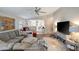 Spacious living room with high ceilings, comfortable seating, and open layout to the kitchen at 8413 N Hamner Ave # A, Tampa, FL 33604