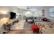 Comfortable living room with a gray sectional couch, throw pillows, and area rug at 8413 N Hamner Ave # A, Tampa, FL 33604