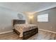 Bedroom with wood floors, a window, and a bed with a decorative comforter at 10530 77Th Ter # 224, Seminole, FL 33772