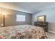 Bright bedroom with a comfortable bed and dresser at 10530 77Th Ter # 224, Seminole, FL 33772