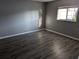 Bedroom featuring light-filled window and light-colored wood-look flooring at 10530 77Th Ter # 224, Seminole, FL 33772