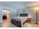 Cozy bedroom with wood-look flooring, adjacent to the bathroom at 10530 77Th Ter # 224, Seminole, FL 33772