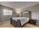 Bedroom with a large bed, wood furniture, and a window at 10530 77Th Ter # 224, Seminole, FL 33772