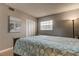 Bedroom featuring a comfy bed, white closet doors and beach decor at 10530 77Th Ter # 224, Seminole, FL 33772