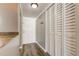 A neutral hallway with closet, door, and modern flooring enhances the home's flow at 10530 77Th Ter # 224, Seminole, FL 33772