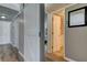 Hallway with an open doorway leading to a bedroom at 10530 77Th Ter # 224, Seminole, FL 33772
