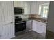 A bright kitchen showcases stainless steel appliances, granite countertops, and ample cabinet space at 10530 77Th Ter # 224, Seminole, FL 33772