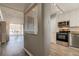 Modern kitchen featuring stainless steel appliances, granite counters, and white cabinets at 10530 77Th Ter # 224, Seminole, FL 33772
