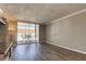 Living room with wood floors and a sliding door to a patio at 10530 77Th Ter # 224, Seminole, FL 33772