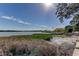 Waterfront view showcasing a scenic dock overlooking the calm water, perfect for enjoying nature at 10530 77Th Ter # 224, Seminole, FL 33772