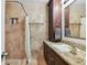 Bathroom featuring granite countertops, vanity and tiled shower at 12738 Wood Trail Blvd, Tampa, FL 33625