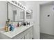 A bright bathroom featuring a well-lit mirror, spacious countertop, and modern fixtures at 12738 Wood Trail Blvd, Tampa, FL 33625