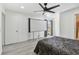 Spacious bedroom with large window and modern ceiling fan at 12738 Wood Trail Blvd, Tampa, FL 33625