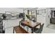 Cozy dining area with a wooden table, stylish chairs, and backyard views at 12738 Wood Trail Blvd, Tampa, FL 33625