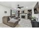 Bright living room with a fireplace and large window at 12738 Wood Trail Blvd, Tampa, FL 33625