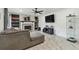 Cozy living room featuring a fireplace and stylish built-in shelving at 12738 Wood Trail Blvd, Tampa, FL 33625