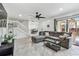 Inviting living room with tile floors, modern decor, and access to the patio at 12738 Wood Trail Blvd, Tampa, FL 33625