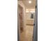 Bathroom with double sinks, white cabinets, and a large mirror at 13052 Ogden Glade Rd, Dade City, FL 33525
