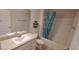 Clean bathroom with a shower-tub combo, toilet, and a sink with vanity at 13052 Ogden Glade Rd, Dade City, FL 33525