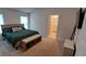 Comfortable bedroom featuring natural light and an en suite bathroom at 13052 Ogden Glade Rd, Dade City, FL 33525