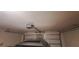 Garage ceiling with garage door opener at 13052 Ogden Glade Rd, Dade City, FL 33525