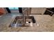 Stainless steel kitchen sink with faucet and light countertops at 13052 Ogden Glade Rd, Dade City, FL 33525