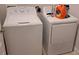 White washer and dryer set in the laundry room at 13052 Ogden Glade Rd, Dade City, FL 33525
