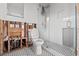Renovated bathroom featuring a glass enclosed shower, hexagon tile floors, and a new toilet at 1500 Carson Ne Cir, St Petersburg, FL 33703