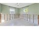 A bedroom showcasing a block wall interior with two windows allowing natural light to fill the room at 1500 Carson Ne Cir, St Petersburg, FL 33703