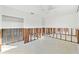 Open living room featuring hardwood floors, an exposed ceiling fan, and an exposed foundation at 1500 Carson Ne Cir, St Petersburg, FL 33703