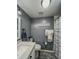 Cozy bathroom with gray walls, an updated vanity, and a shower/tub combo at 19029 Us Highway 19 N # 12E, Clearwater, FL 33764