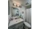 Updated bathroom features a gray vanity and shower-tub combination at 19029 Us Highway 19 N # 12E, Clearwater, FL 33764