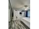 Bright bedroom featuring wood-look floors and plenty of storage space at 19029 Us Highway 19 N # 12E, Clearwater, FL 33764