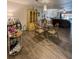 Dining room open to the living room and featuring a glass table with seating for four at 19029 Us Highway 19 N # 12E, Clearwater, FL 33764