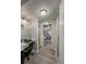 Hallway view to bathroom with vanity and shower at 19029 Us Highway 19 N # 12E, Clearwater, FL 33764
