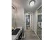 Hallway view to bathroom with vanity and shower at 19029 Us Highway 19 N # 12E, Clearwater, FL 33764