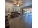 Bright living room with comfortable seating and sliding door access to an outdoor living space at 19029 Us Highway 19 N # 12E, Clearwater, FL 33764