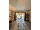 Bright living room with sliding glass doors leading to a covered outdoor patio space at 19029 Us Highway 19 N # 12E, Clearwater, FL 33764
