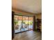 Living room view with sliding glass doors leading to the outdoor patio at 19029 Us Highway 19 N # 12E, Clearwater, FL 33764