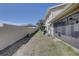 Exterior backyard view featuring the back of home with screened lanai and lawn at 2131 Ridge S Rd # 132, Largo, FL 33778