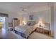 Comfortable bedroom features neutral tones, a ceiling fan, and coordinated furnishings at 2131 Ridge S Rd # 132, Largo, FL 33778