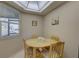 Bright breakfast nook with a round table, four chairs and a window that offers ample natural light at 2131 Ridge S Rd # 132, Largo, FL 33778